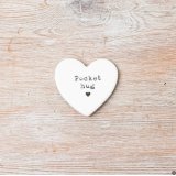 A chic porcelain heart with a pocket hug slogan. A unique token to gift to friends and loved ones. 