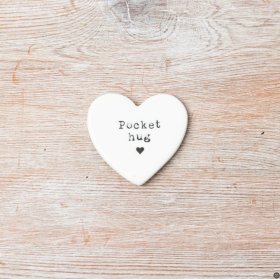 A chic porcelain heart with pocket hug engraved onto the surface. 