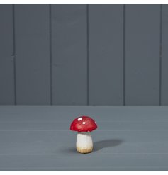 A realistic red mushroom decoration with white polkadots.
