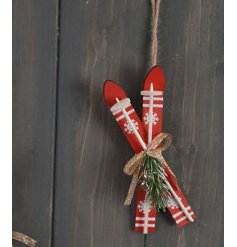 A rustic hanging tree decoration in a ski slope design. 