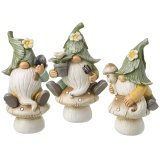 3 assorted garden gnomes perched on toadstools each holding a gardening accessory. 