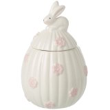 This charming egg-shaped jar with a sitting rabbit on top and flower ceramic details is the perfect addition to any home