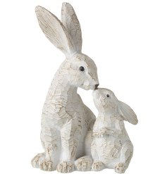 An adorable carved mother and baby rabbit kissing decoration. 