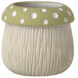 A beautifully crafted and detailed mushroom shaped pot with earthy green and white polka dots.