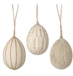 An assortment of 3 hanging egg decorations in white and gold glitter.