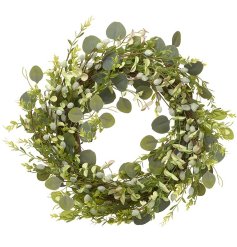 A rustic willow wreath dressed with artificial foliage and green pussy willow. A full and luxurious seasonal wreath.