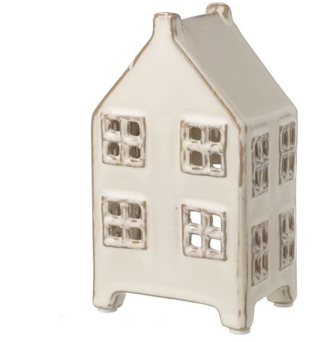 This traditional ornamental house with a white wash glaze is sure to add a festive charm to the home. 