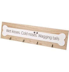 A chunky wooden plaque featuring a pet associated quote with 4 metal hooks and paw print detail. 