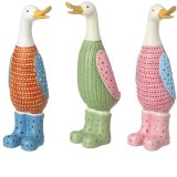 An assortment of 3 colourful and contemporary duck figures, each with an engraved dotty design. 