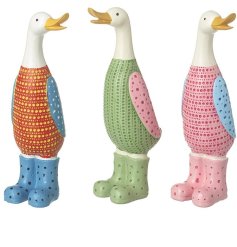 An assortment of 3 colourful and contemporary duck figures, each with an engraved dotty design. 
