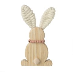 A simplistic wooden sitting bunny ornament detailing a pom pom tail, bead necklace and wool ears.
