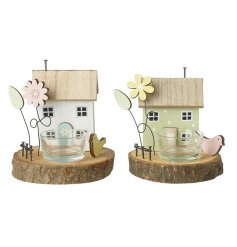 This dainty wooden house features lovely little additions to bring a spring charm into any living space.