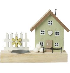 Introduce a rustic charm to the home with this delightful wooden tea light house decoration.
