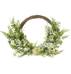 A gorgeous spring time wreath featuring an array of green and white artificial flowers and foliage. 