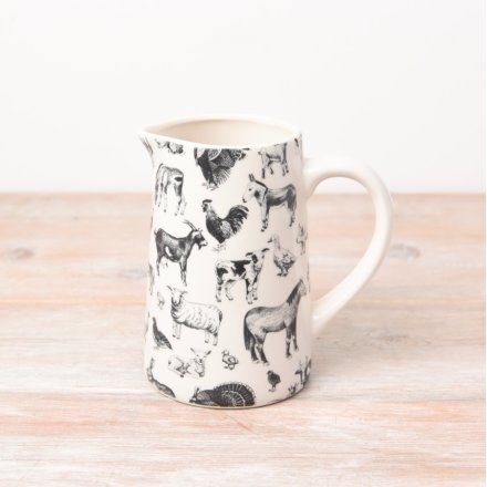 A white jug with black detailed images of farmyard animals. 
