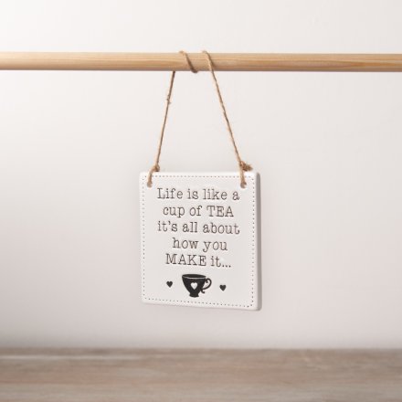 A chic and simple ceramic sign with a rustic jute string hanger. Engraved with a popular tea slogan and patterned edge.