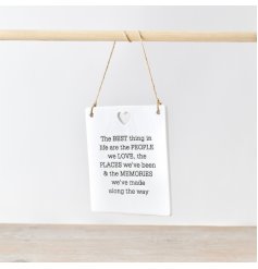 A sweet ceramic plaque adorned with heartwarming words engraved.