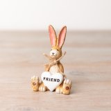 A charming sitting rabbit decoration with a heart shaped Friend decoration. 