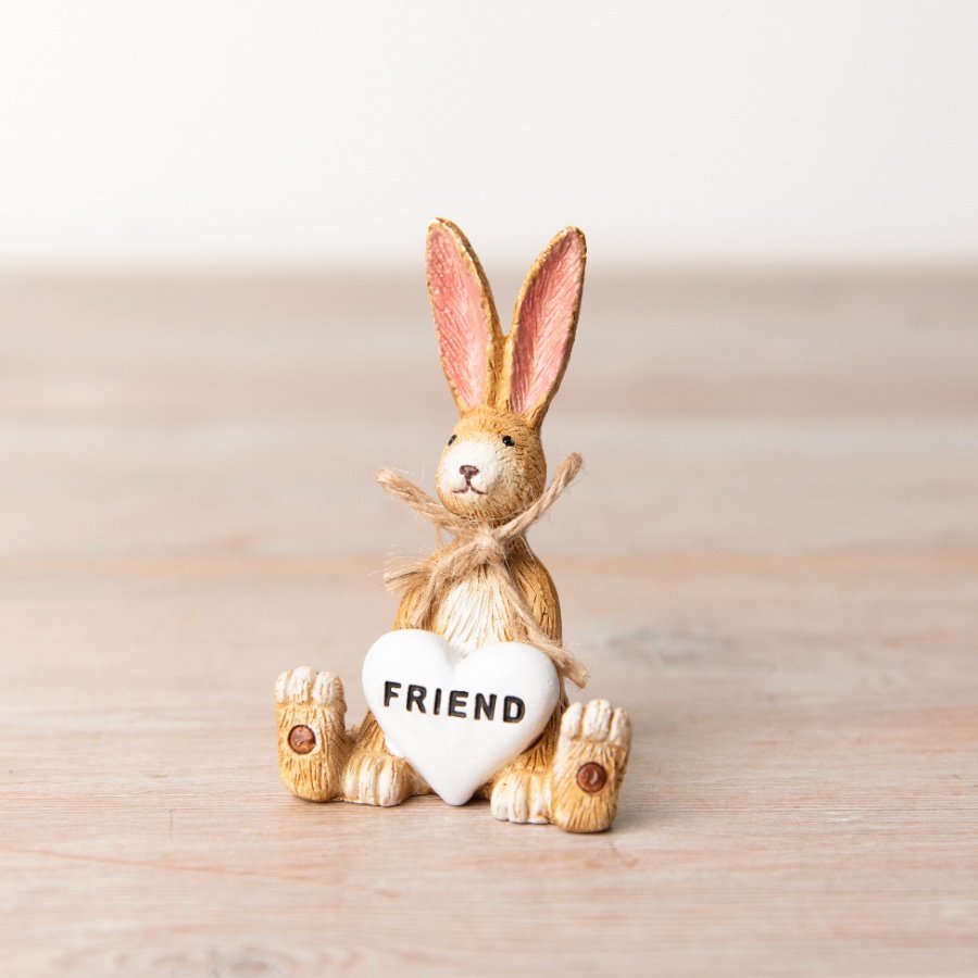 A charming sitting rabbit decoration with a rustic jute string bow and Friend heart detail.