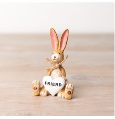 A charming sitting rabbit decoration with a heart shaped Friend decoration. 