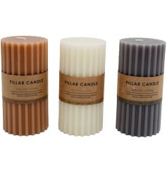 Elevate the atmosphere of any room with this selection of three timeless ribbed pillar candles.