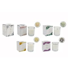A fragranced candle adorned with pretty crystals in 5 assorted designs. 