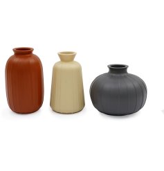 A set of 3 stylish vases in different shapes, finished with a simple matte texture.