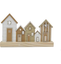 A natural coloured seashore house scene set on a chunky wooden block