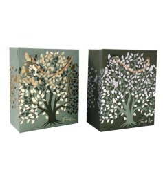 A large gift bag in green and cream colour tones featuring a tree of life design. 