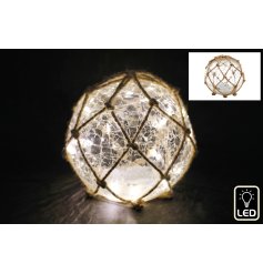 A gorgeous LED crackle ball wrapped with jute rope in a net design. 