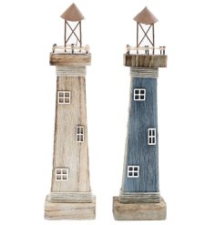 2 assorted lighthouse ornaments made from wood with nautical details finished with a whitewash look. 
