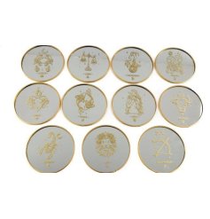 A mirrored coaster in 12 assorted zodiac designs, each with a golden rimmed edge. 
