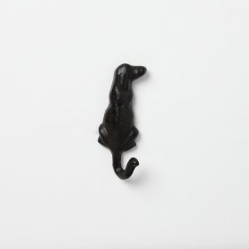 A rustic wall hook in a dog's tail design. 