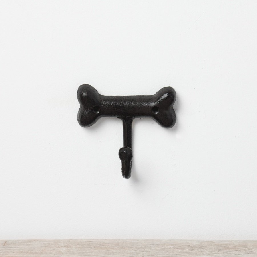 A cast iron wall hook in a dog bone design. 