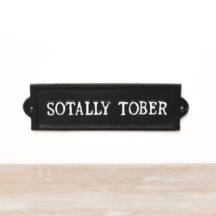 A fun and witty monochrome iron sign with 'sotally tober' wording 