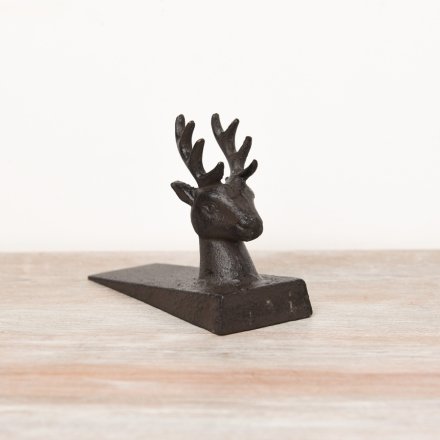 A rustic cast iron door wedge in a stag design. 