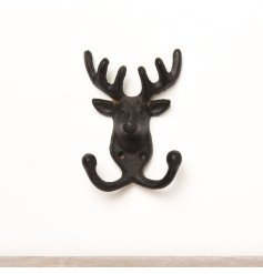 A cast iron deer wall ornament featuring two hooks 