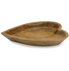 A gorgeous wooden bowl carved into a heart shape. 