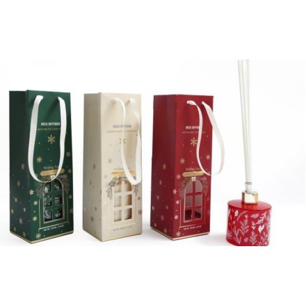 Decorated in snowflakes and christmas patterns, an assortment of 3 Christma reed diffusers complete with a matching gift