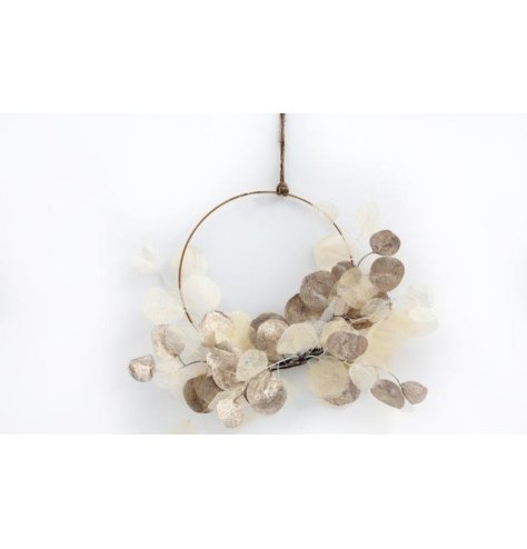 A chic hanging ring made from artificial eucalyptus sprigs, hung by jute twine. 