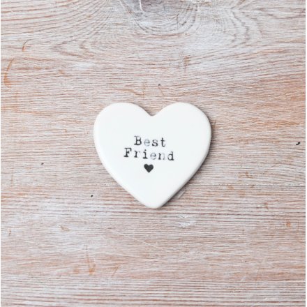 A dainty heart shaped token with 'Best friend' text and a mini heart stamp.