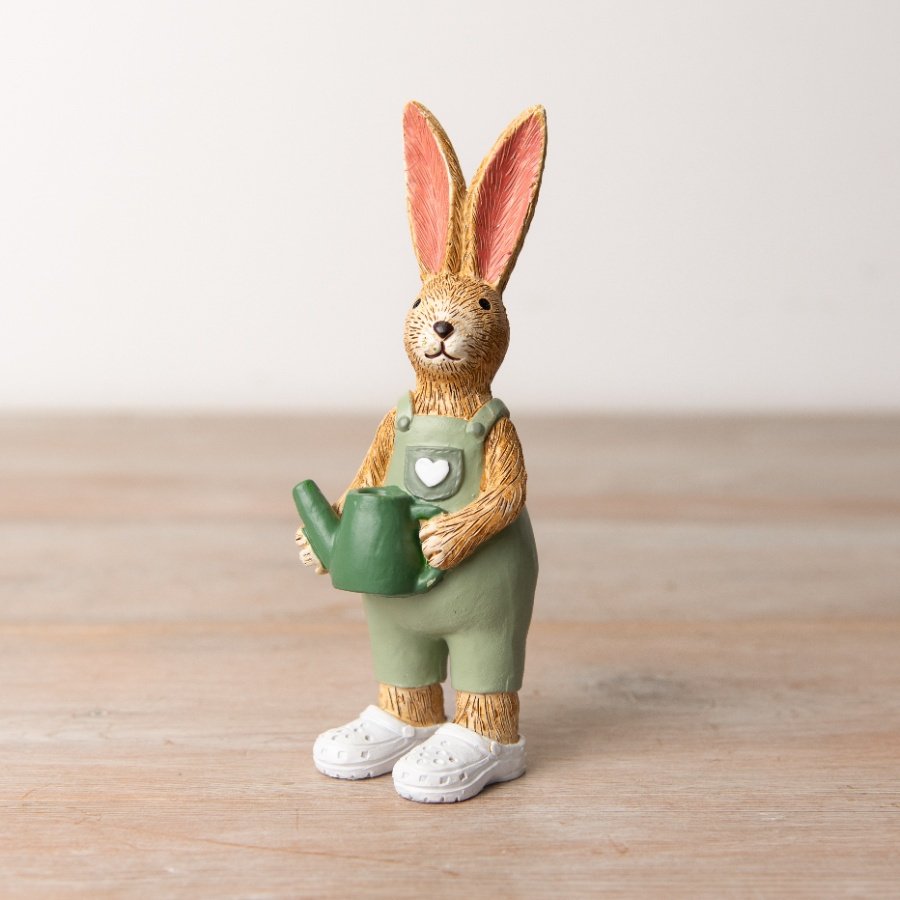 A beautifully crafted seasonal decoration with charming garden themed details including dungarees and a watering can.