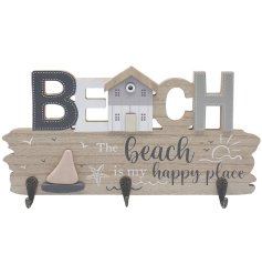 A nautical wall plaque with 'Beach' wording and 3 iron hooks, ideal for holding the keys to the beach chalet! 