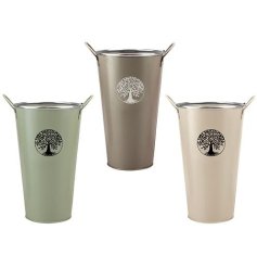 A chic metal flower bucket with handles in 3 assorted designs, each displaying the Tree of Life symbol.