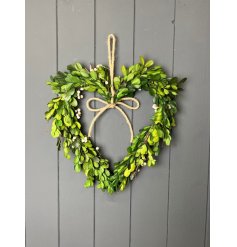 This elegant heart shaped wreath is bursting with vibrant greenery, a gorgeous showstopper for the home decor 