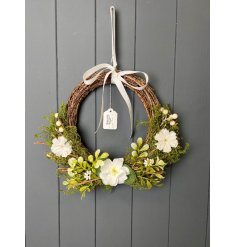 Step into spring with this gorgeous foliage wrapped wreath adorned with multiple berries and flowers.