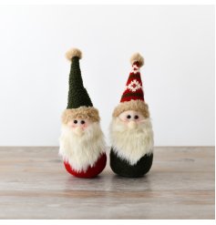 A collection of two endearing little gonks, each adorned with both traditional and festive red and green hats.