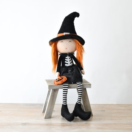 Sitting Halloween Witch with Pumpkin