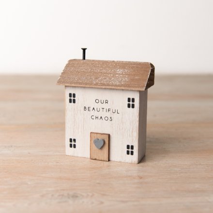 A rustic wooden house ornament with a distressed finish and charming OUR BEAUTIFUL CHAOS slogan. 