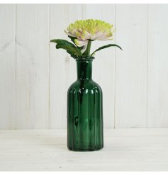 A gorgeous dark green glass bottle with a chunky ribbed pattern. 